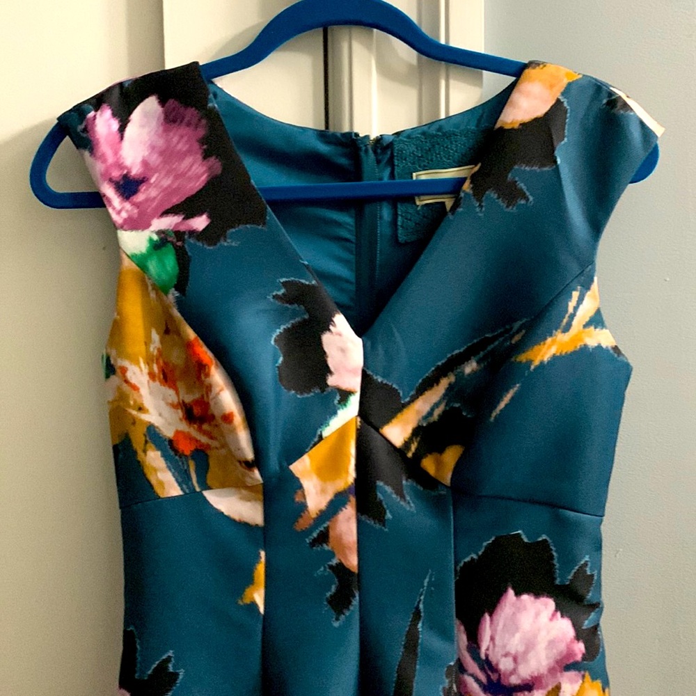 A-line dress with cap sleeves . Large Floral print. Satin feel material